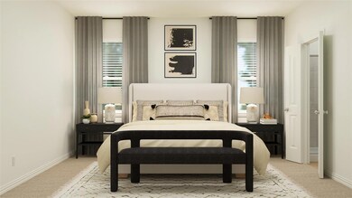 Bedroom featuring light carpet