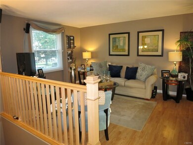 The living room features hardwood floors and a new