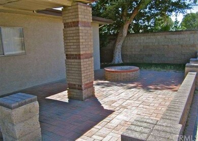 Covered front entryway with brick patio
