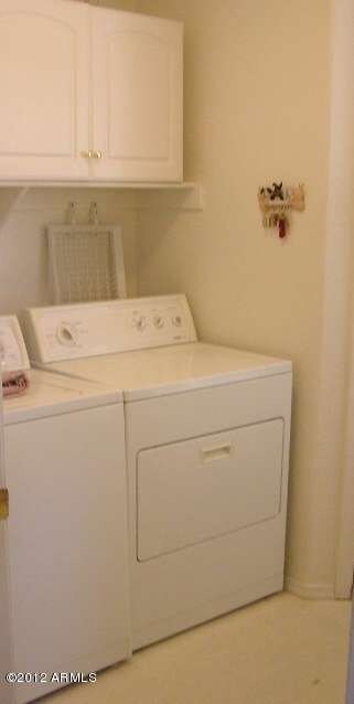 INDOOR LAUNDRY ROOM WITH CABINETS