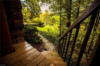 These side stairs off the deck take you down into the front of the yard to the large pond.