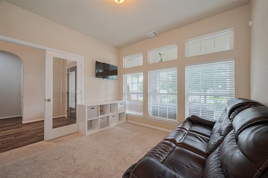 This inviting office/library features plush carpet