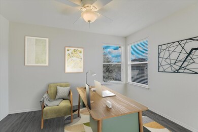 Office space with dark wood finished floors and c