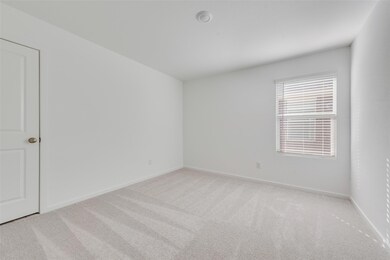 Unfurnished room with light carpet