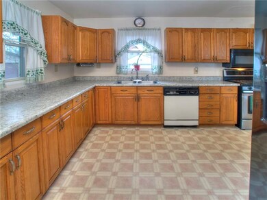 Spacious kitchen with oak cabinetry