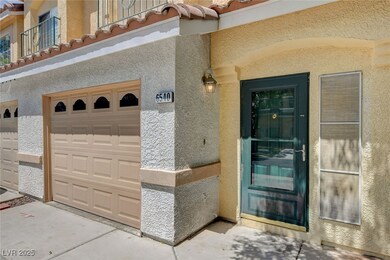 Entrance to property with stucco siding