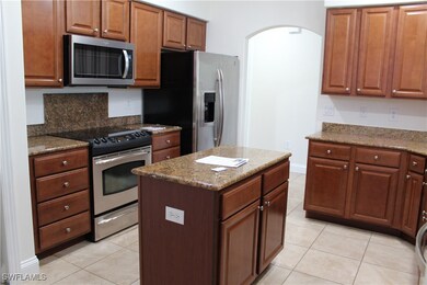 Kitchen featuring stainless steel appliances, ligh