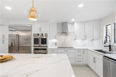 Kitchen featuring stainless steel appliances, whit