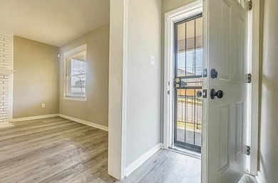 Entryway featuring light wood finished floors and baseboards