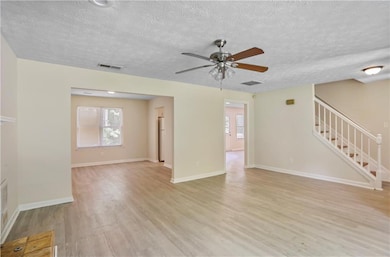 Unfurnished living room featuring light wood-type 