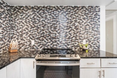 Kitchen featuring stainless steel electric range 