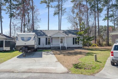 View of front of home featuring crawl space, drive