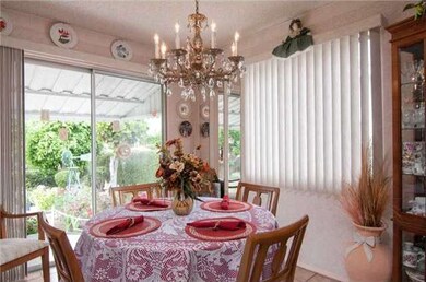 Sun filled dining room with direct access to an en