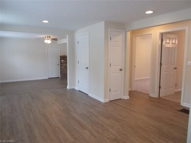 View from Dining area toward Living Room and Bedrooms.  Guest Closet and Linen Closet provided.