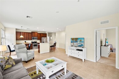 Living area featuring recessed lighting and light tile patterned floors