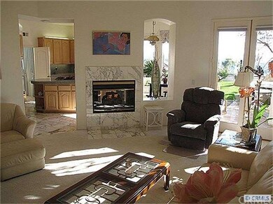 Family room with see through fireplace to kitchen.