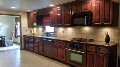 GALLEY KITCHEN HAS TOP OF THE LINE APPLIANCES WITH