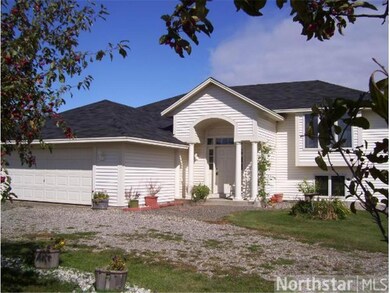 Welcoming entrance to home. There is a gravel park