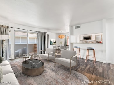 Living room with dark wood-style floors