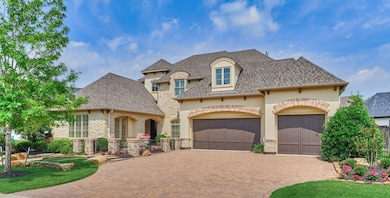 This beautiful home features a stone and stucco ex