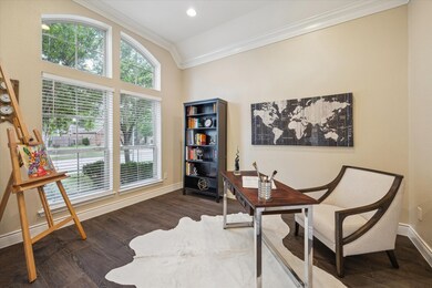 Office with a view of the tree filled front yard.