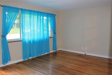 Family room features a large picture window and be