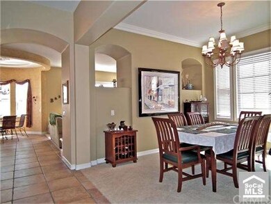 Formal dining room view leading into great room