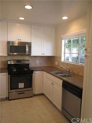 Kitchen featuring stainless steel microwave, never