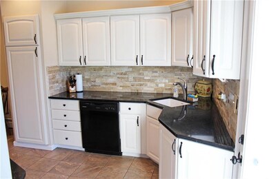 Eat-in kitchen with granite and Corian countertops