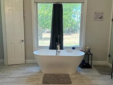 Luxurious bath with soaking tub, dual vanities, an