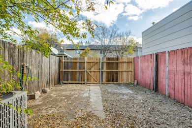 Fenced backyard with a gate
