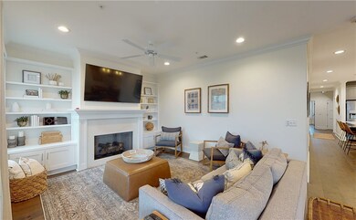 Dual custom built bookcase & cabinets complete the
