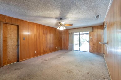 Unfurnished room featuring ceiling fan, light colo