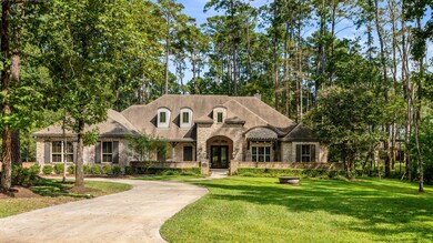 Old World brick facade with a spacious driveway le