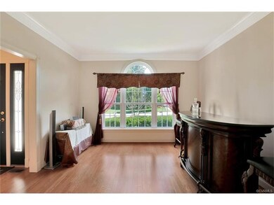 Formal Living Room with detailed crown molding and