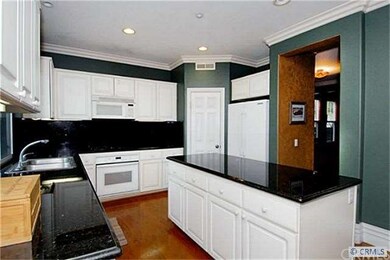 Good counter space in kitchen. doorway goes to din