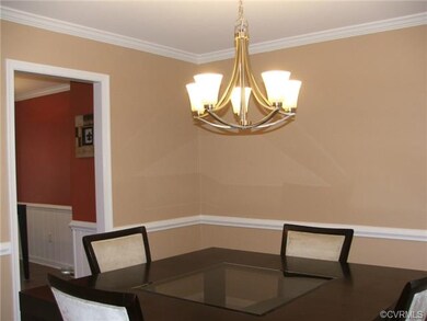 Dining Room with chandelier, crown & chair rail mo