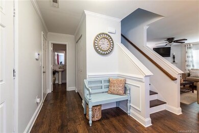 Entry with hall to the 2 car garage, down stairs h