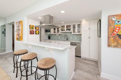 Kitchen open to living area. Cambria countertops,