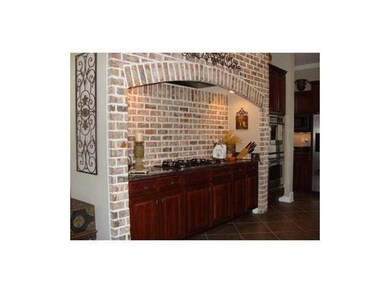Cafeteria/Kitchen. Brick alcove encompasses gas co