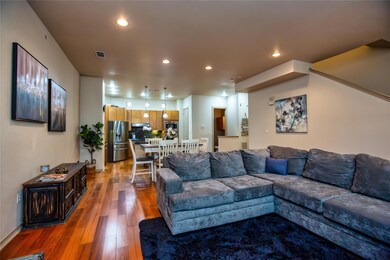 2nd Floor: Living room with recessed lighting, and