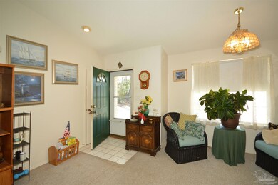 opens to family room and sitting/dining room