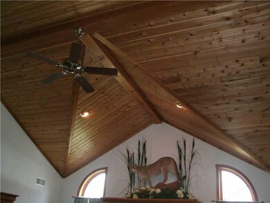 Great Room. Soaring cedar vaulted ceilings add a d