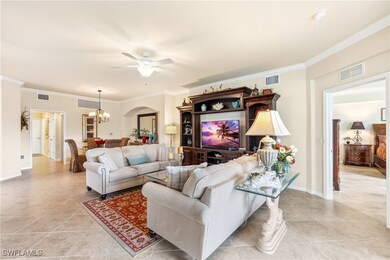 Living room with light tile patterned floors, ceil
