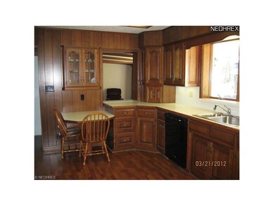 Gorgeous solid wood kitchen with huge window over looking back yard! Washing dishes will be enjoyable while watching the deer frolic in the woods!