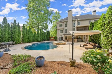Outdoor pool featuring a patio, an in ground hot t