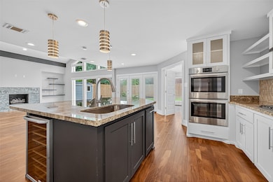 This modern kitchen features a large island with a