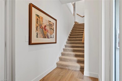 Stairs featuring wood-type flooring