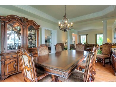 The lovely formal dining room boasts a fabulous ch