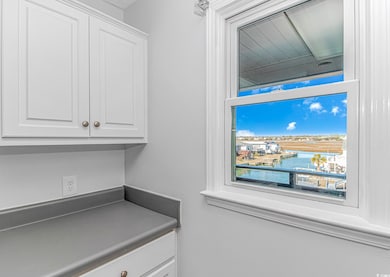 Interior space with white cabinets and a water vie